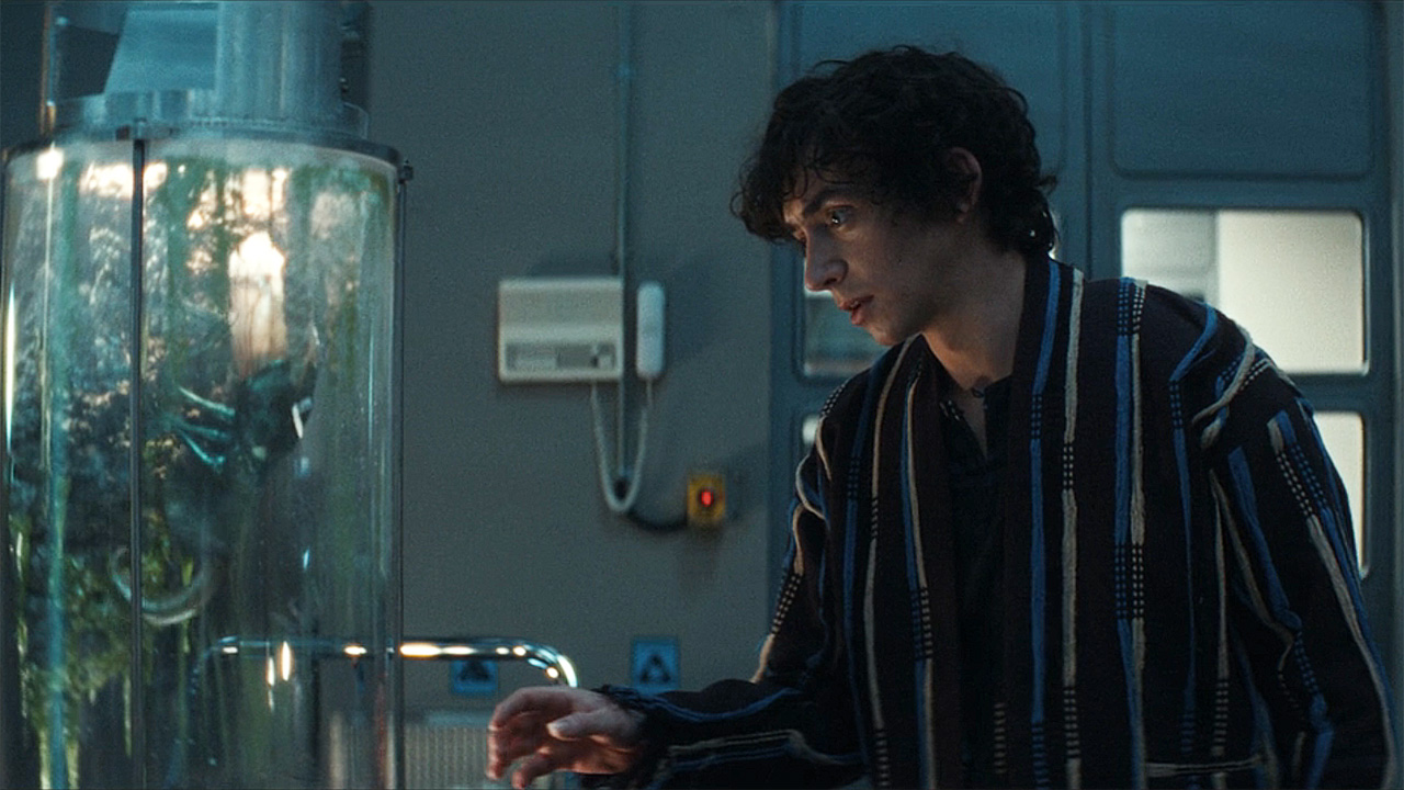 Boy Kavalier inspecting an alien lifeform in Alien: Earth episode 3