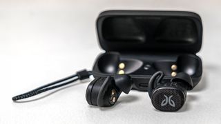 Jaybird Vista 2 earbuds loose in front of case.