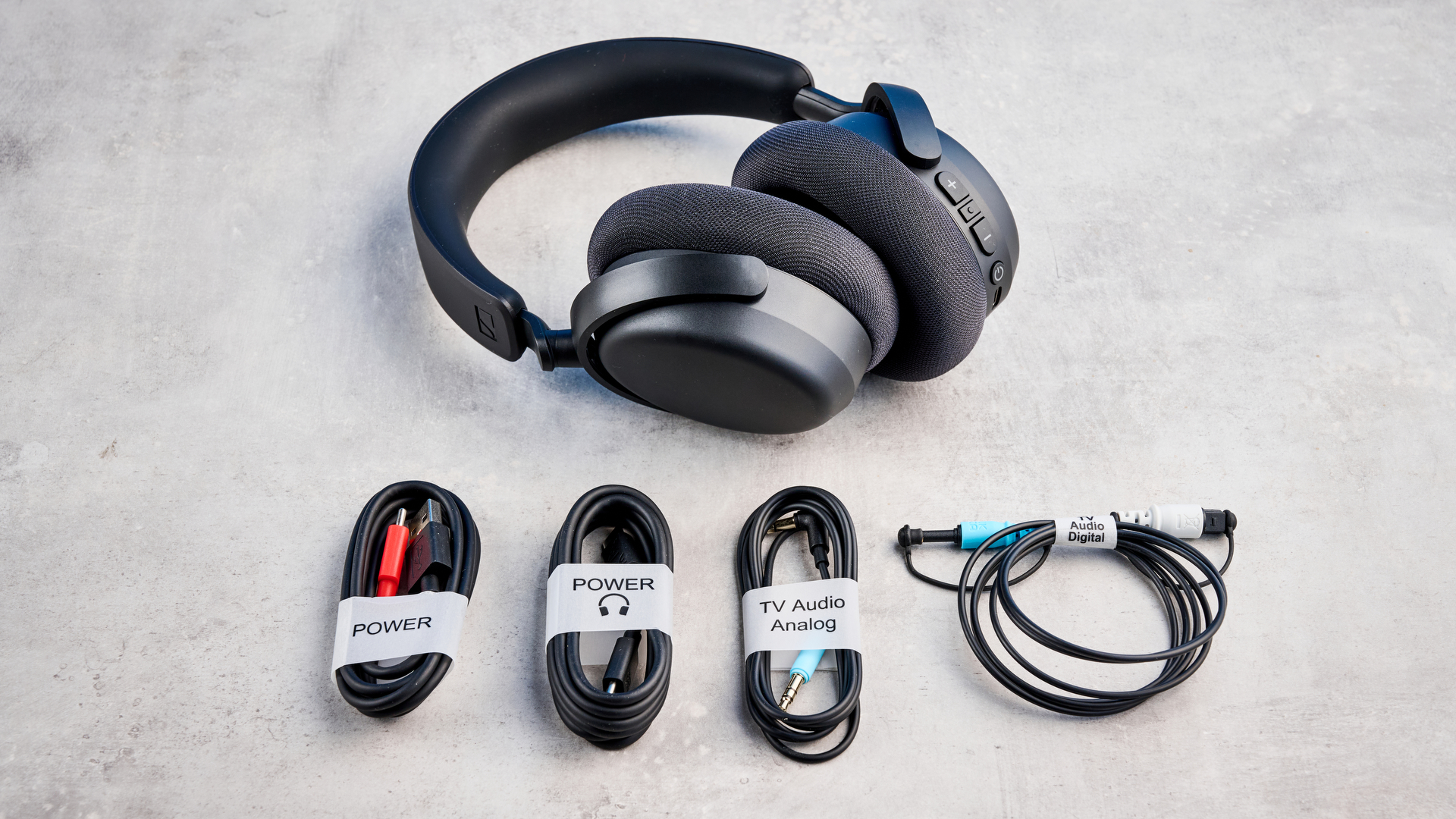 The Sennheiser RS 275 with cables on a stone surface