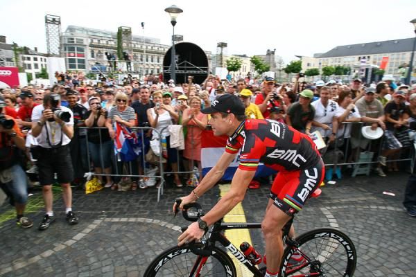The defending champion Cadel Evans rolls to the stage in Liege