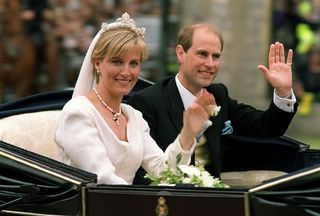 Prince Edward and Sophie waving from a carriage on their wedding day