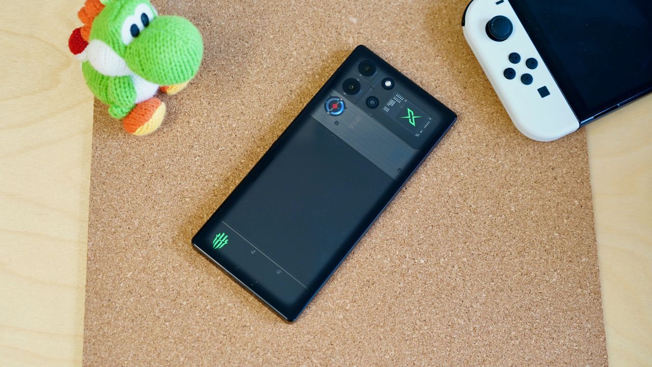 The Nubia Red Magic 10 Pro phone sitting on a wooden table
