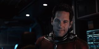 Scott Lang smiles from the control room while wearing his Ant-Man suit.