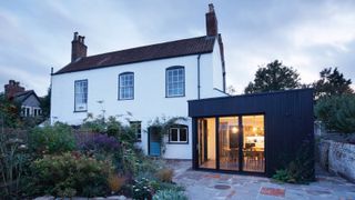white rendered cottage with modern single storey extension