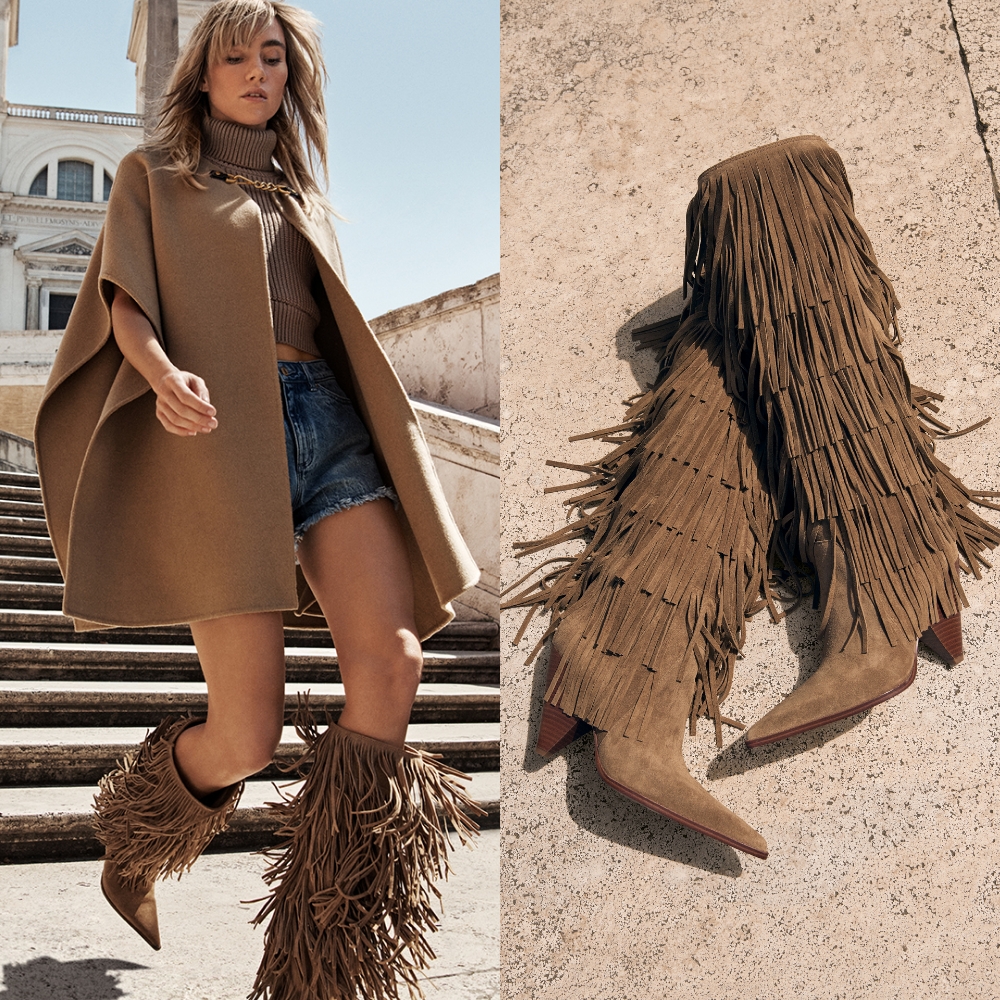 Two images, one of a model walking down steps wearing a beige cape, denim shorts and light brown suede fringe knee high boots sold at Michael Kors and close up of the boots