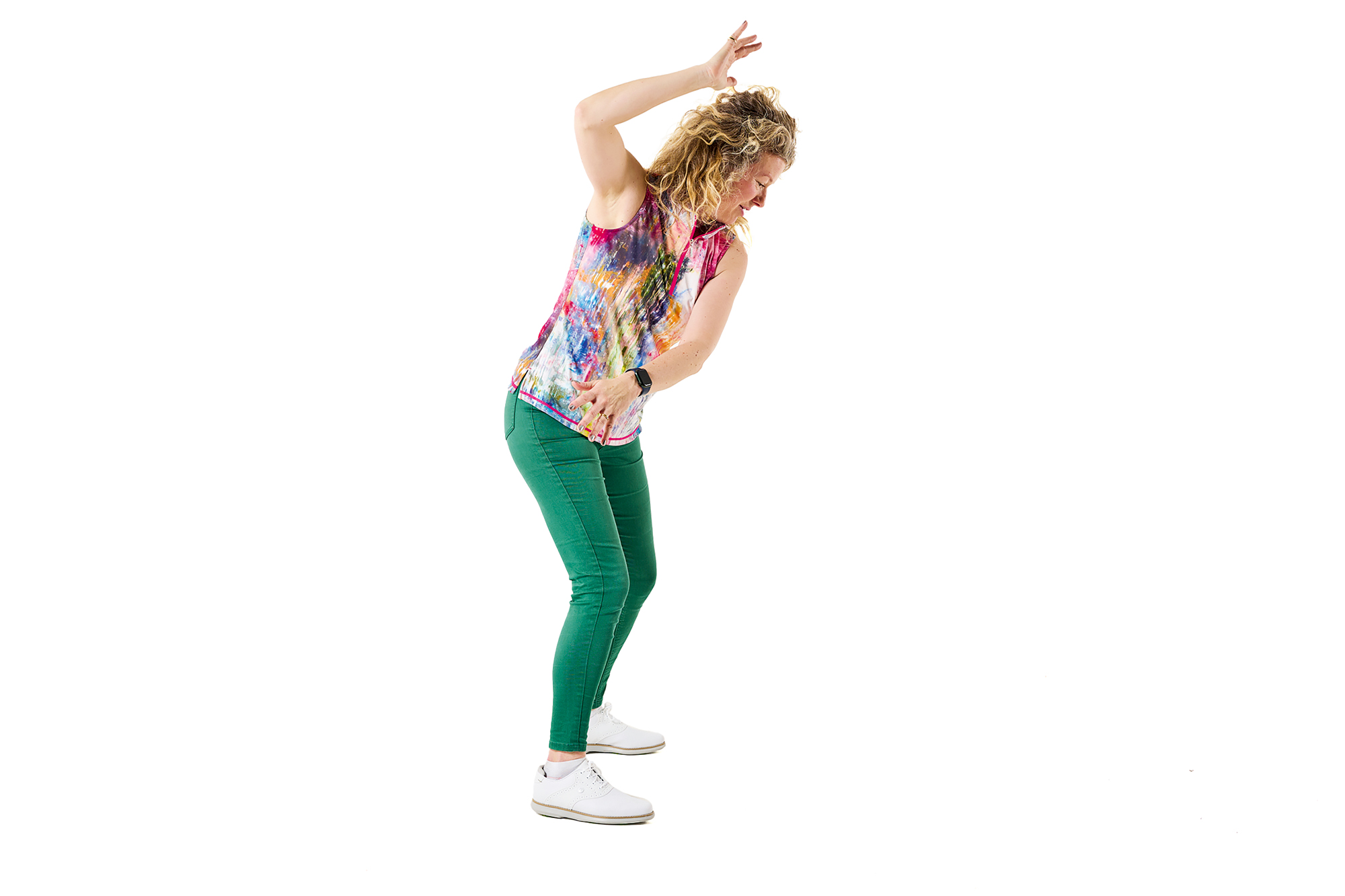 Katie Dawkins demonstrating what the flying elbow looks like in the backswing, with trail elbow facing up and out