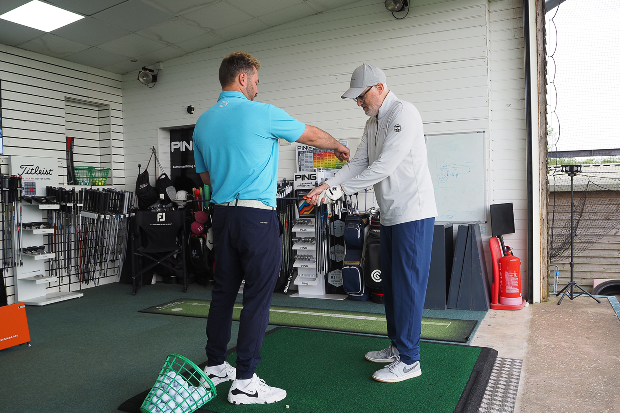 Rob Spedding receiving tuition on his grip from a top PGA professional in a golf lesson