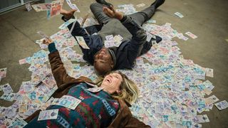 Janet and Samuel lying amongst their drug money in Boat Story episode 3