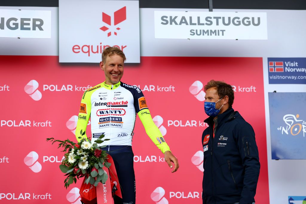 SKALLSTUGGU NORWAY AUGUST 13 Taco Van Der Hoorn of Netherlands and Team Intermarch Wanty Gobert Matriaux celebrates at podium as most combative rider prize winner during the 9th Arctic Race Of Norway 2022 Stage 3 a 1777km stage from Namsos to Skallstuggu 474m ArcticRace on August 13 2022 in Skallstuggu Norway Photo by Michael SteeleGetty Images