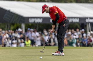 Sergio Garcia striking a putt playing on LIV Golf