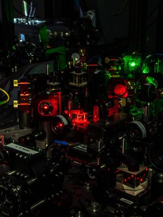 A forest of optical elements to guide single photons from, and laser beams to, each diamond in the entanglement experiment.
