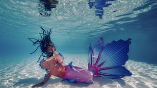 The Blixunami in their mermaid tail underwater