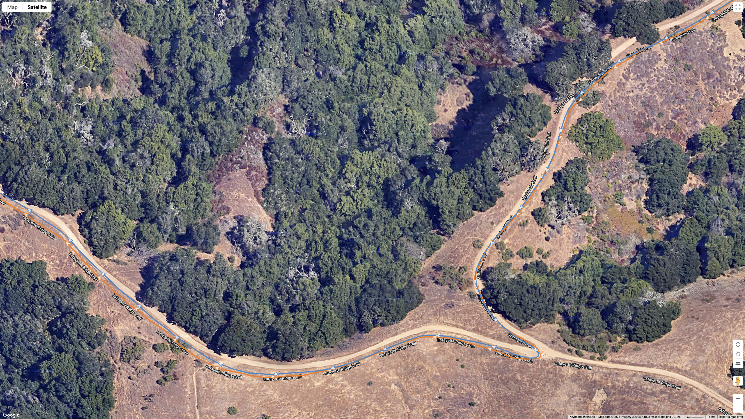 A Google Maps satellite view showing how the COROS APEX 4 (blue) and Garmin Forerunner 970 (orange) compare for GPS-tracked accuracy on a hilly, windy hike.
