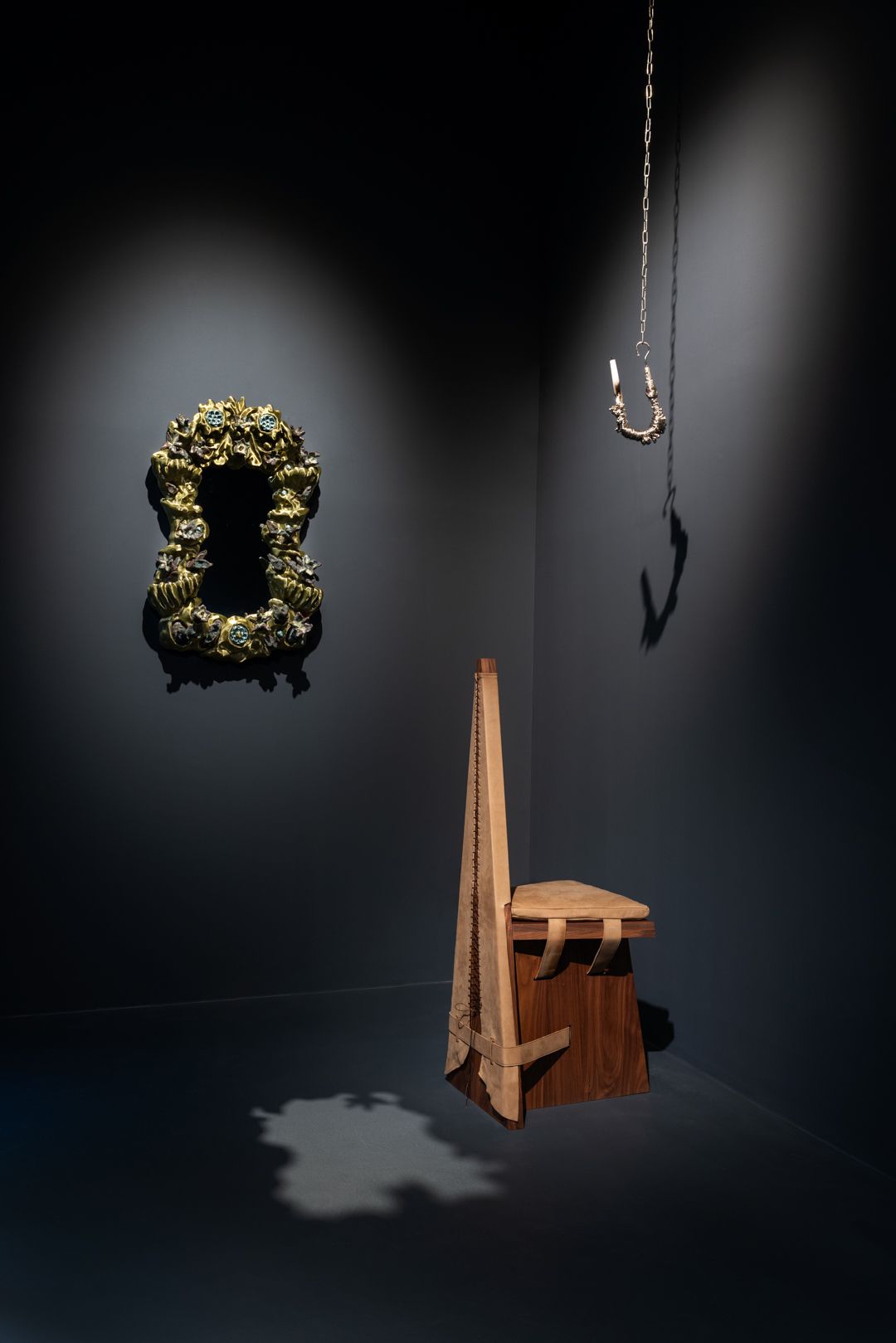 artwork displayed in black gallery space