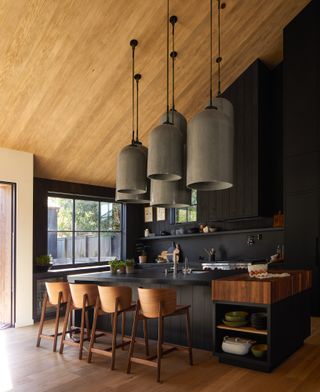 Black kitchen with wooden accents