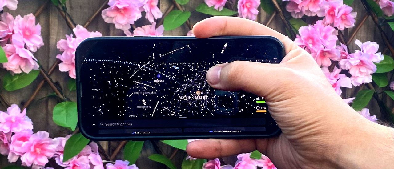 Night sky app open on a smartphone in the author's hand
