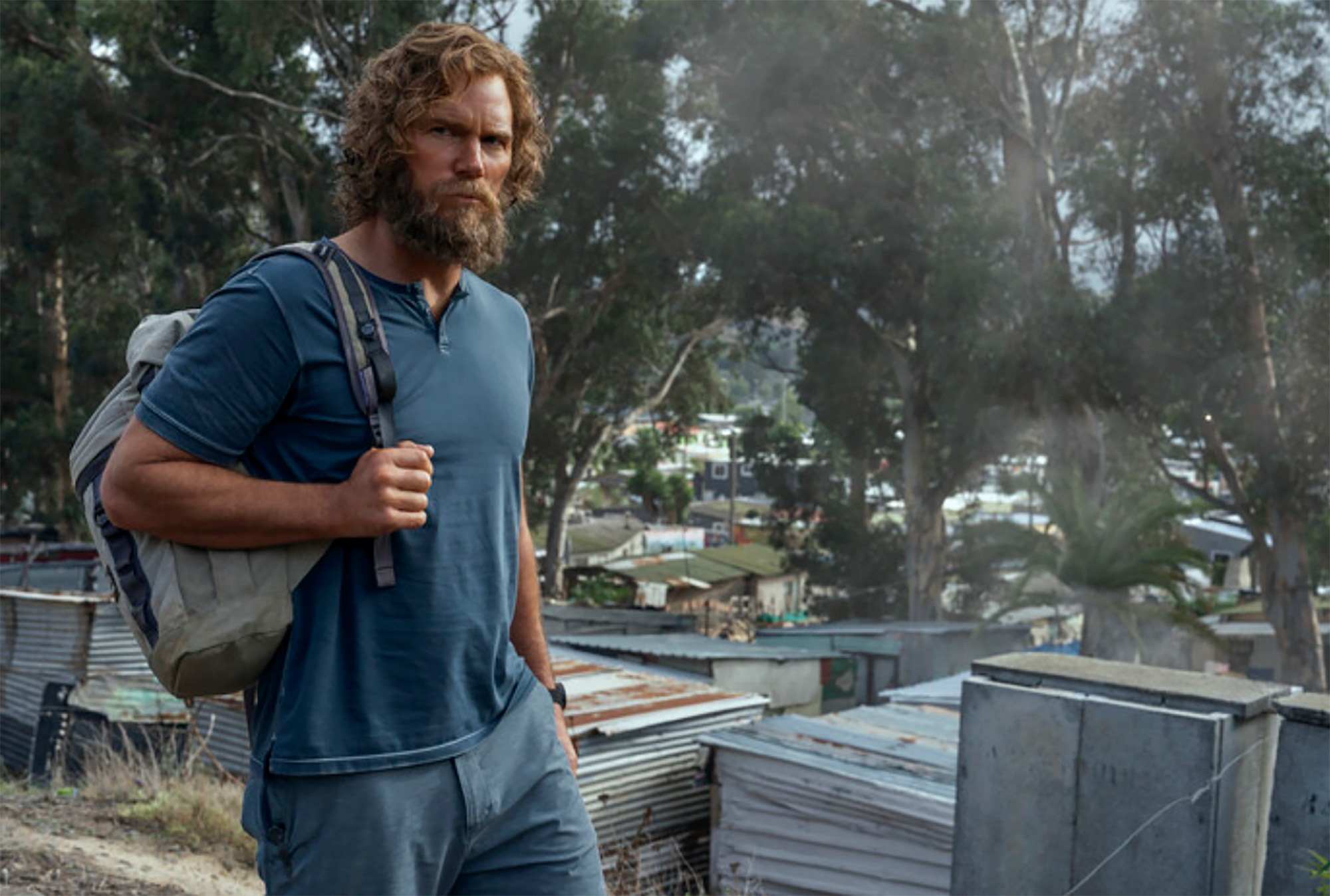James Reece with a full beard and shaggy hair