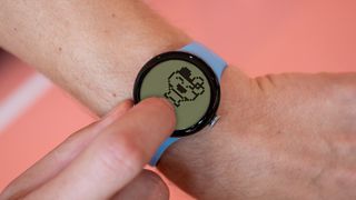 A mock-up of a Tamagotchi virtual pet app on a Wear OS smartwatch