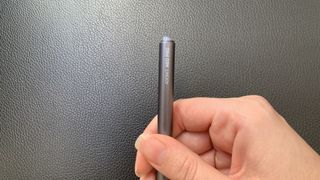 Adonit Neo Pro stylus being held in a hand