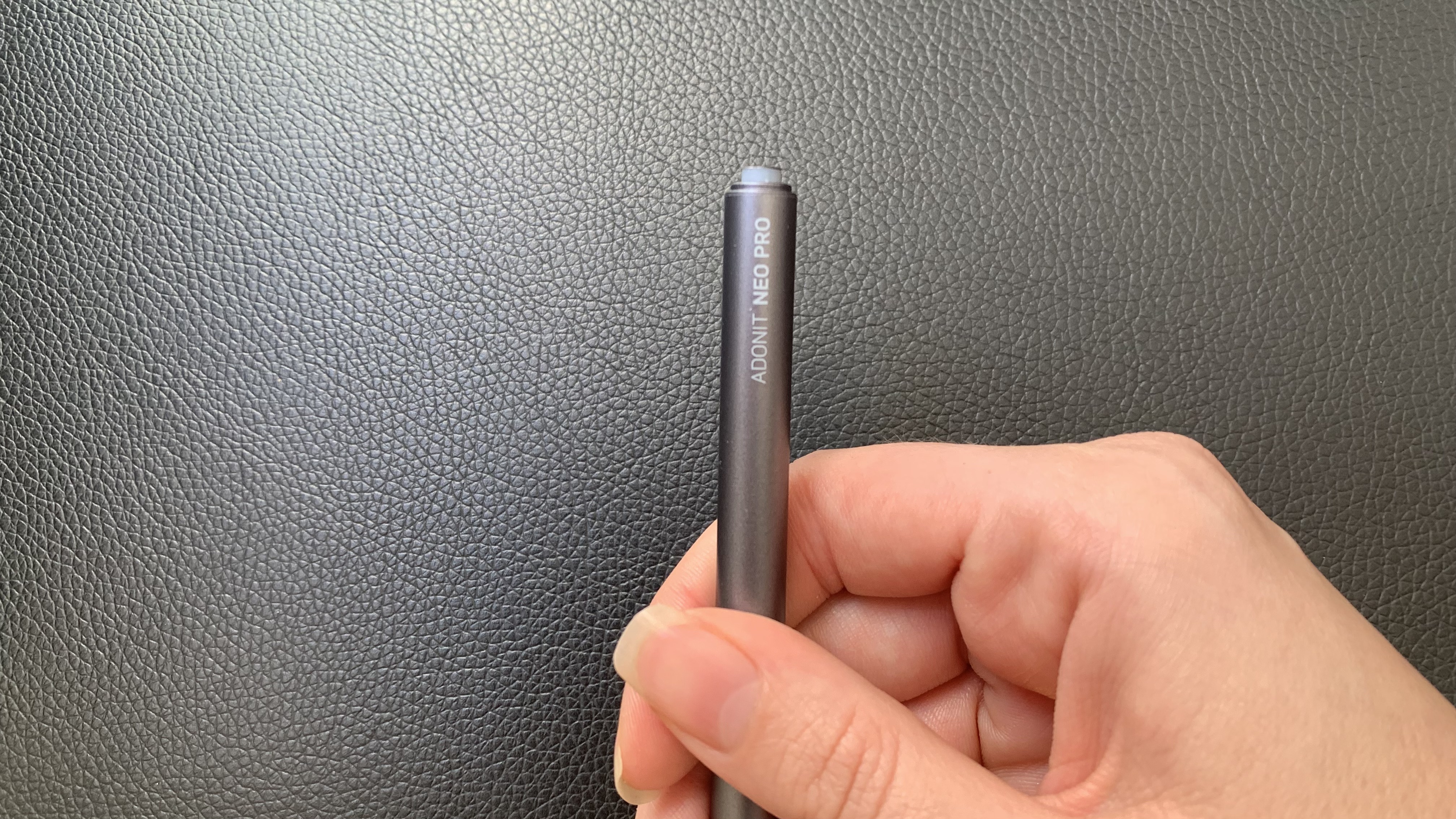 Adonit Neo Pro stylus being held in a hand