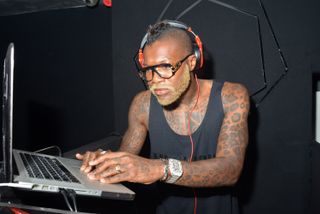 Former footballer Djibril Cisse performs at a DJ party in Cannes in May 2015.