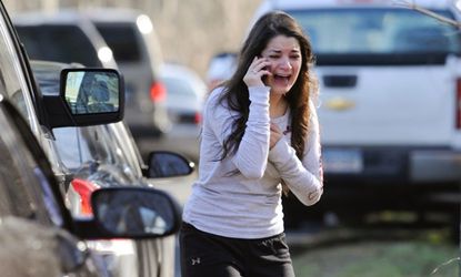 A woman waits to find out if her sister, a teacher at Sandy Hook Elementary is safe.