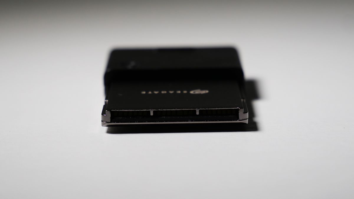 4TB Seagate Storage Expansion Card on a white desk, highlighting its light-and-thin design.