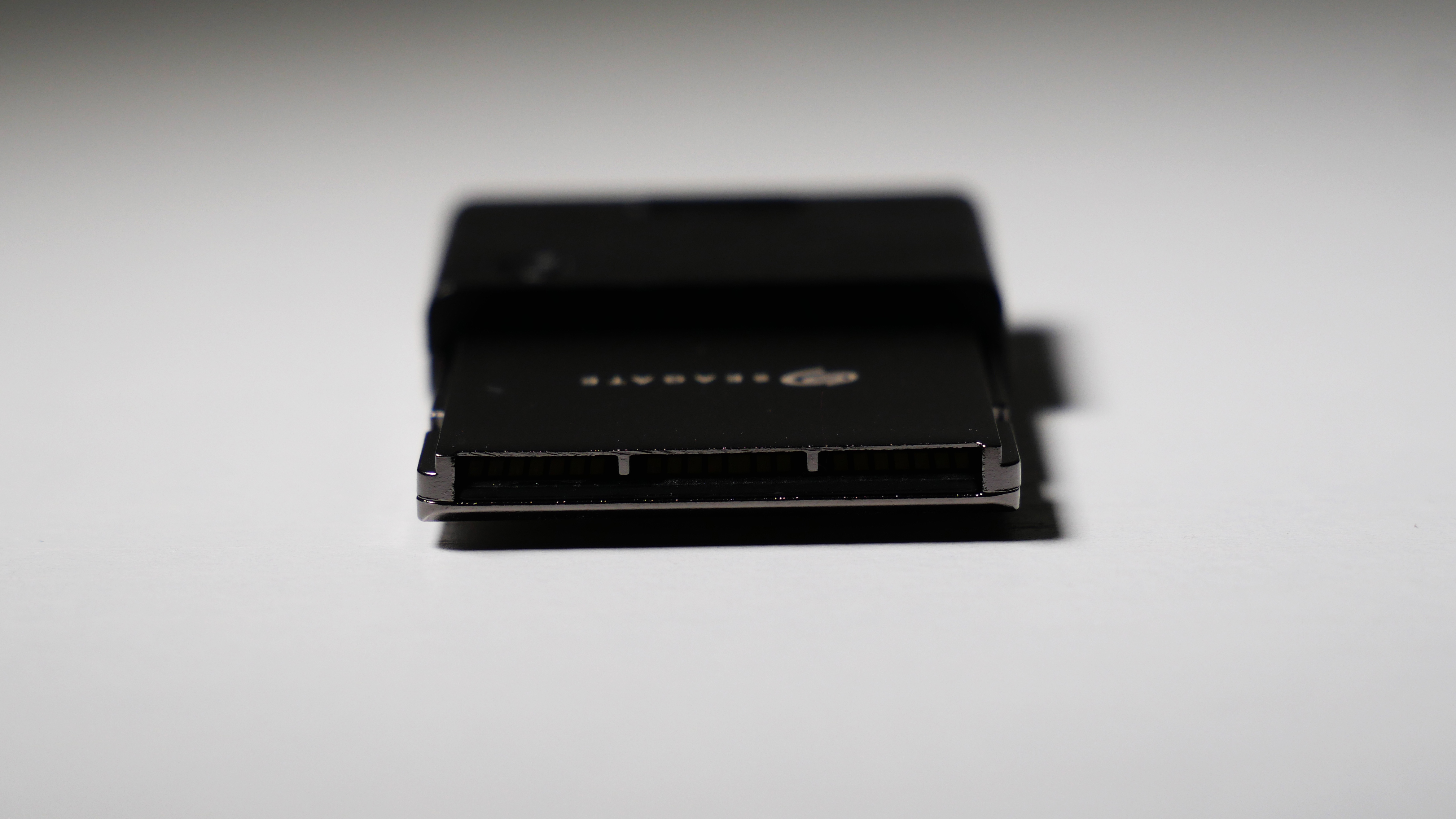 4TB Seagate Storage Expansion Card on a white desk, highlighting its light-and-thin design.