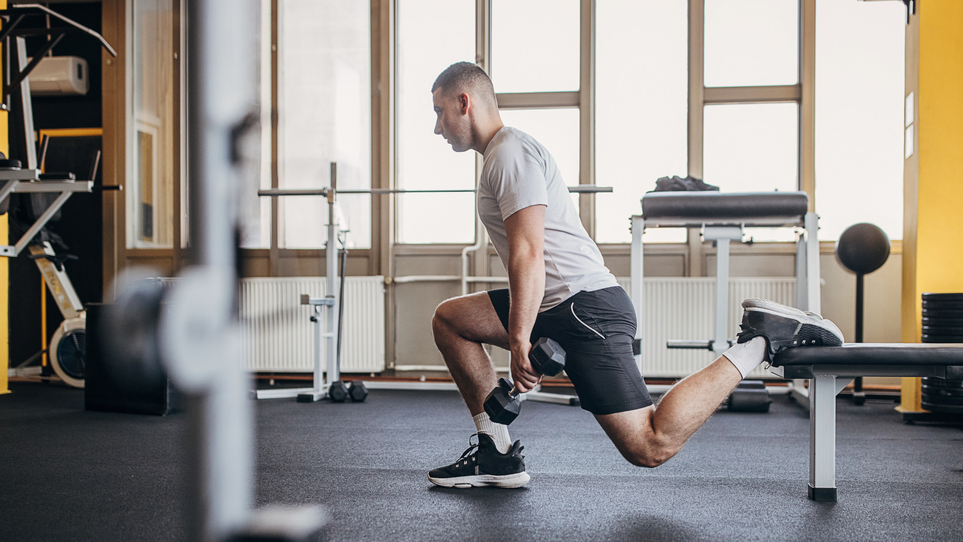 A man performing a bulgarian split squat