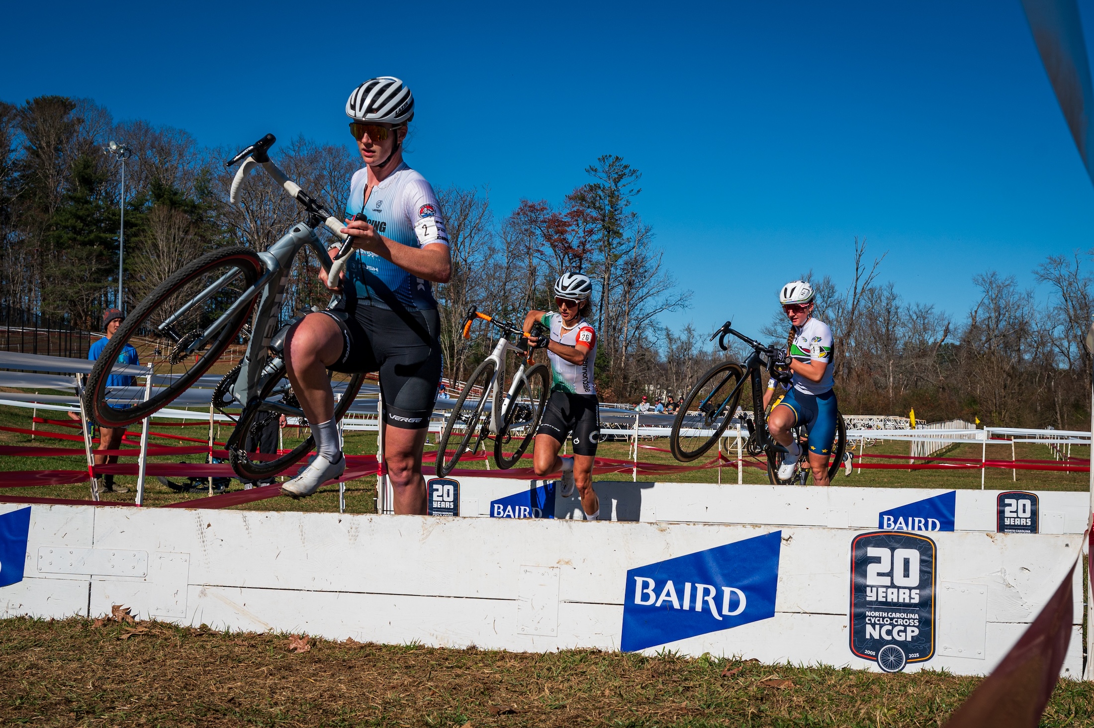 Lauren Zoerner (Competitive Edge Racing) leads Jolanda Neff and Lizzy Gunsalus over the barriers at 2025 North Carolina Grand Prix, the second day of C2 racing
