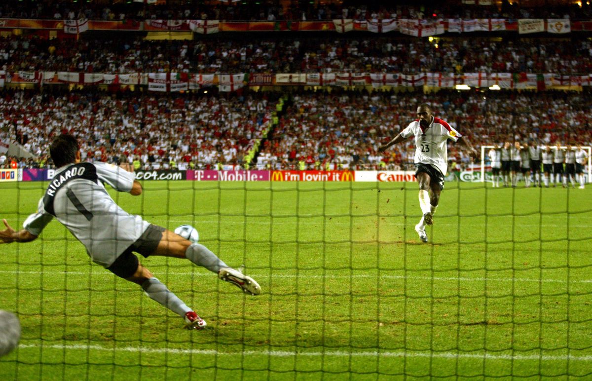 Portugal goalkeeper Ricardo, with his gloves removed, saves the decisive penalty from England's Darius Vassell in the Euro 2004 quarter-final shootout