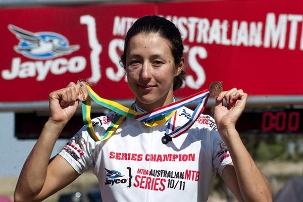 Tasmanian Rowena Fry with her spoils from the women's elite cross country at Mt.Major.
