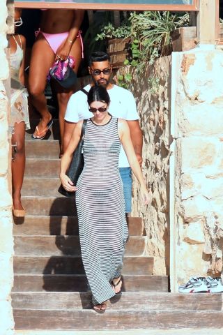 Kendall Jenner wearing a sheer DISSH dress with The Row flip flops in Ibiza August 2024