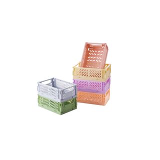 Stacks of multicolored pastel crates
