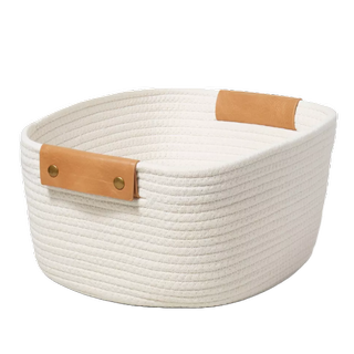 a neutral coiled rope basket