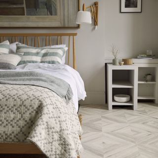 Neutral bedroom with parquet LVT flooring