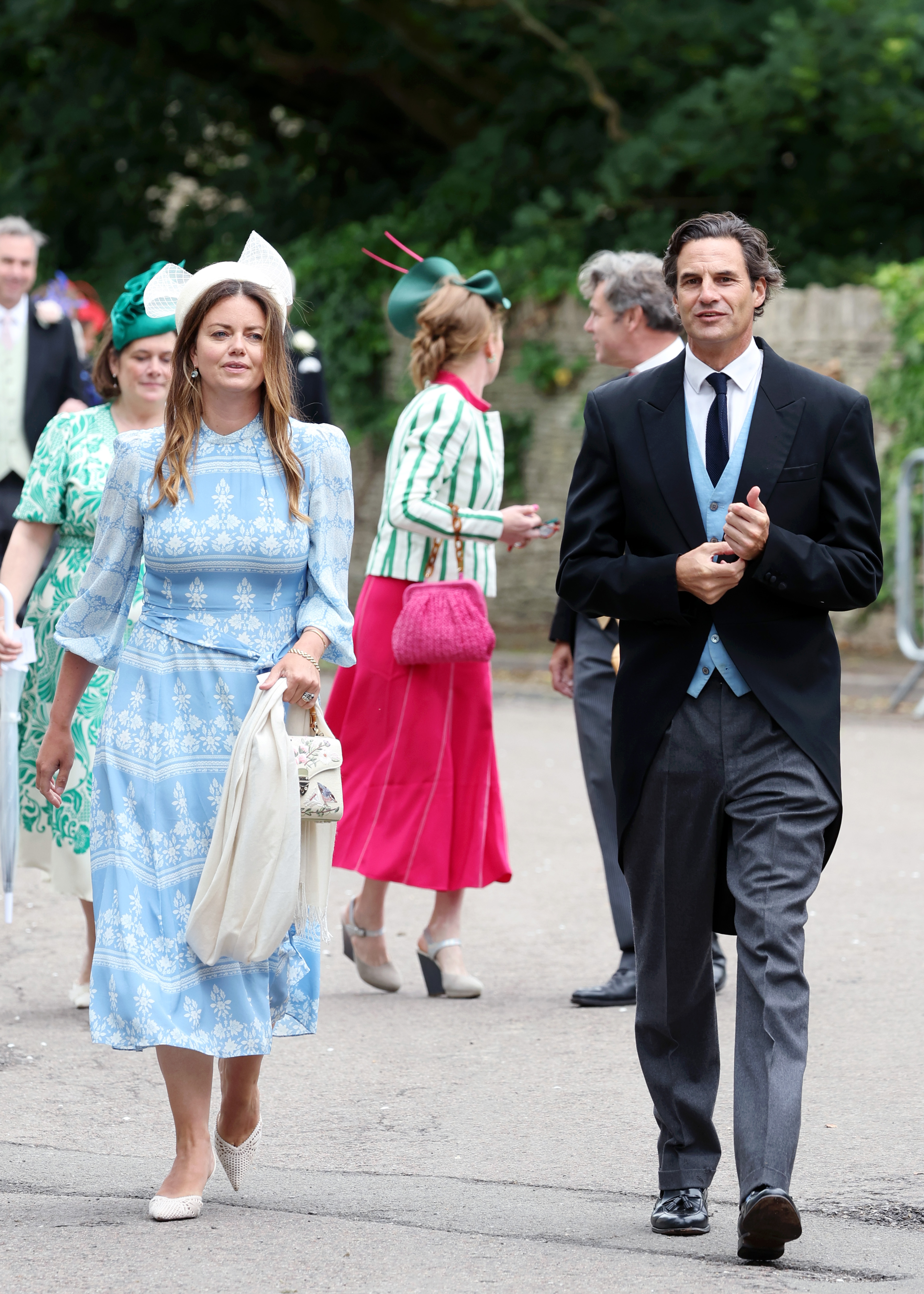 Lady Natasha Rufus Isaacs and Rupert Finch walking into Peter and Harriet's wedding