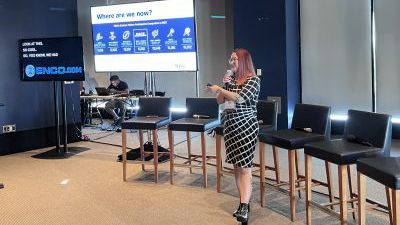 Ashley “AJ” Jones, director of membership sales and services for the National Association of Collegiate Esports (NACE) speaks at the 2022 AV/IT Summit.