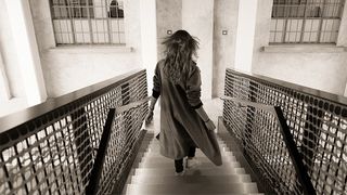 Woman walking down stairs