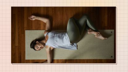 above shot of Indian woman lying down doing yoga wearing yoga pants leggings