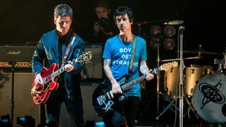 Noel Gallagher and Johnny Marr perform together as a secret surprise at the end of Johnny Marrs show Johnny Marr performs at Brixton Academy on October 23, 2014 in London, England