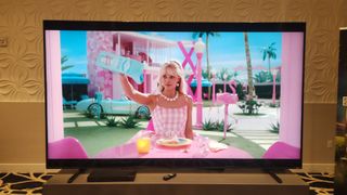 Hisense 116UX showing image of Barbie onscreeen