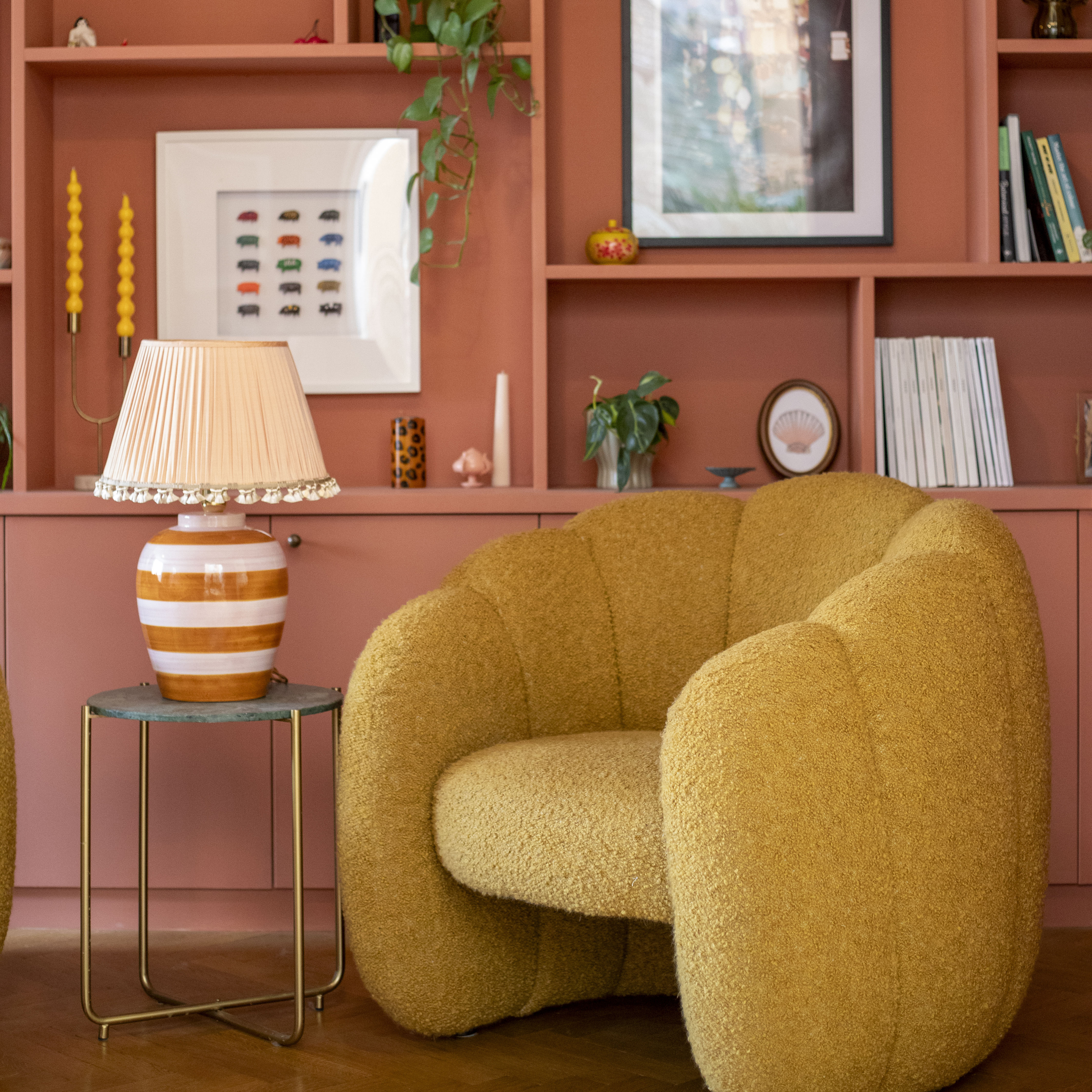 red bookshelf with yellow armchair