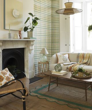 A small cream boucle sofa in neutral living room