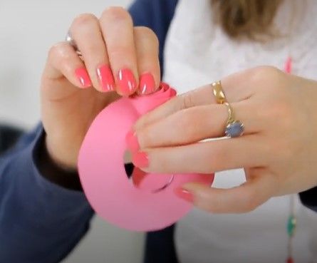 making pink coloured paper flower with hand