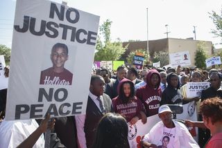 Protesters march in support of Trayvon Martin on March 26, 2012 in Sanford Florida.