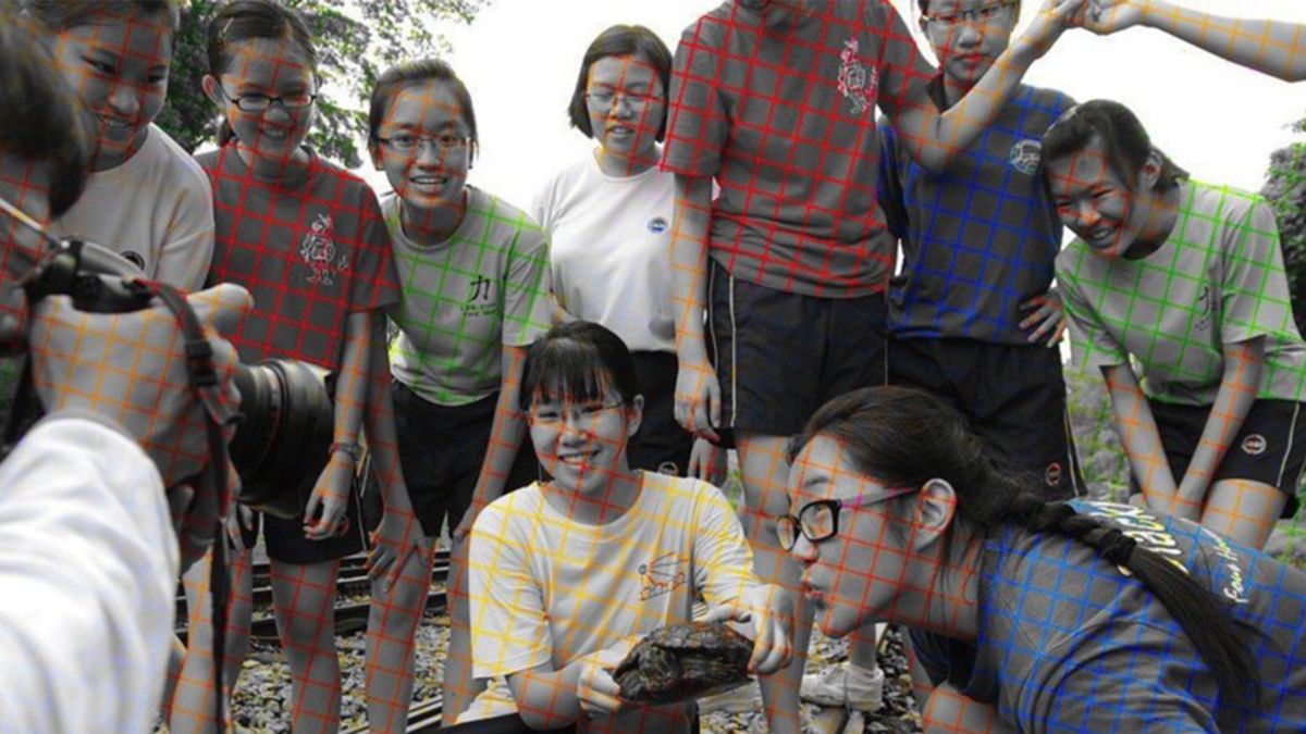 A seemingly coloured photo of a group of teenagers.