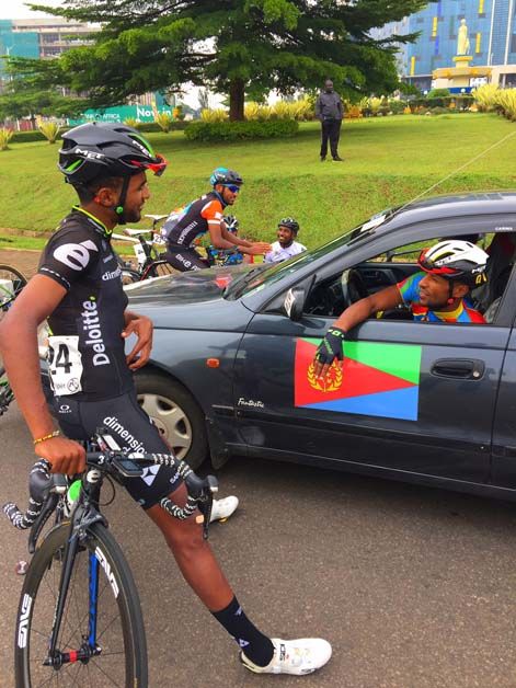 Metkel Eyob talks to one of the riders racing for the Eritrean national team