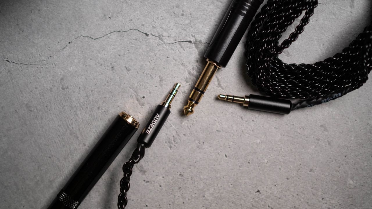 Audeze LCD-S20 planar headset against a grey craft sheet highlighting the product design