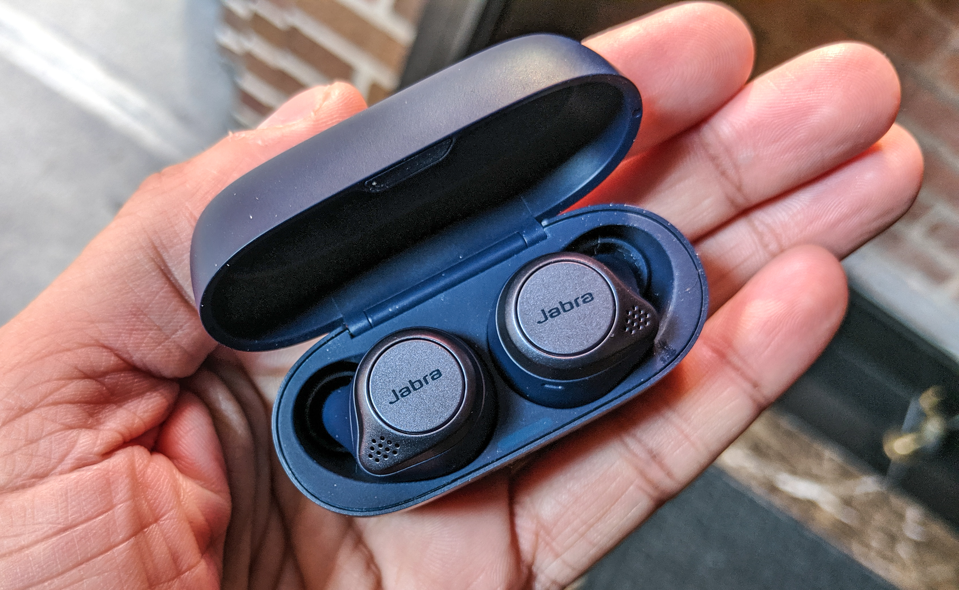 The Jabra Elite Active 75t held in hand